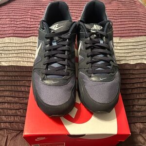 Nike Black Outsole Sneakers with Blue Logo Panels